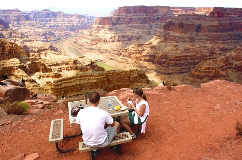 Guests having lunch above the Colorado River at Guano Point, Grand Canyon West
