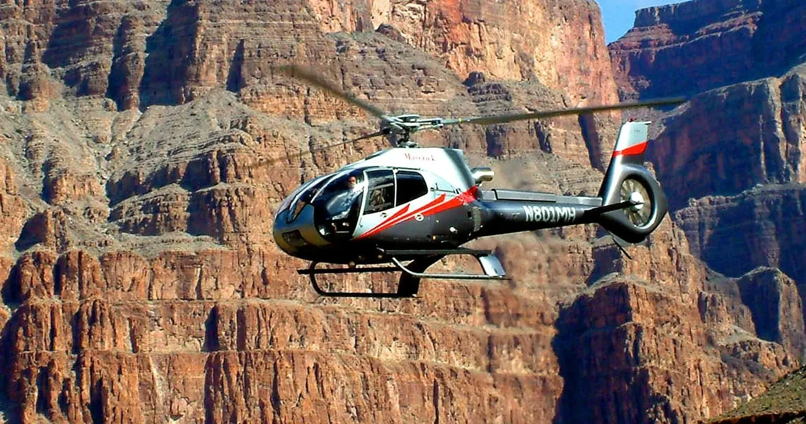 Helicopter flying between the Grand Canyon walls on the Grand Canyon 6-in-1 helicopter tour from Las Vegas